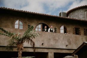 Couple on the second floor balcony of a charming